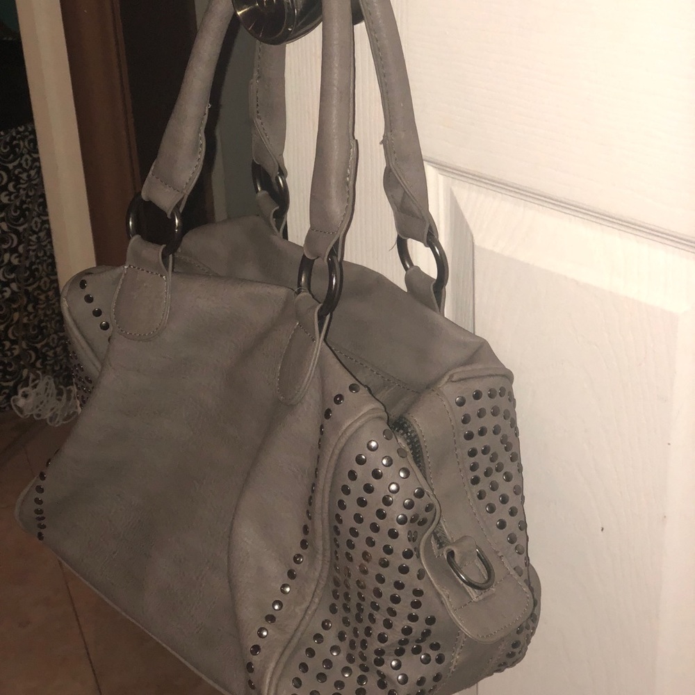 Grey studded leather handbag